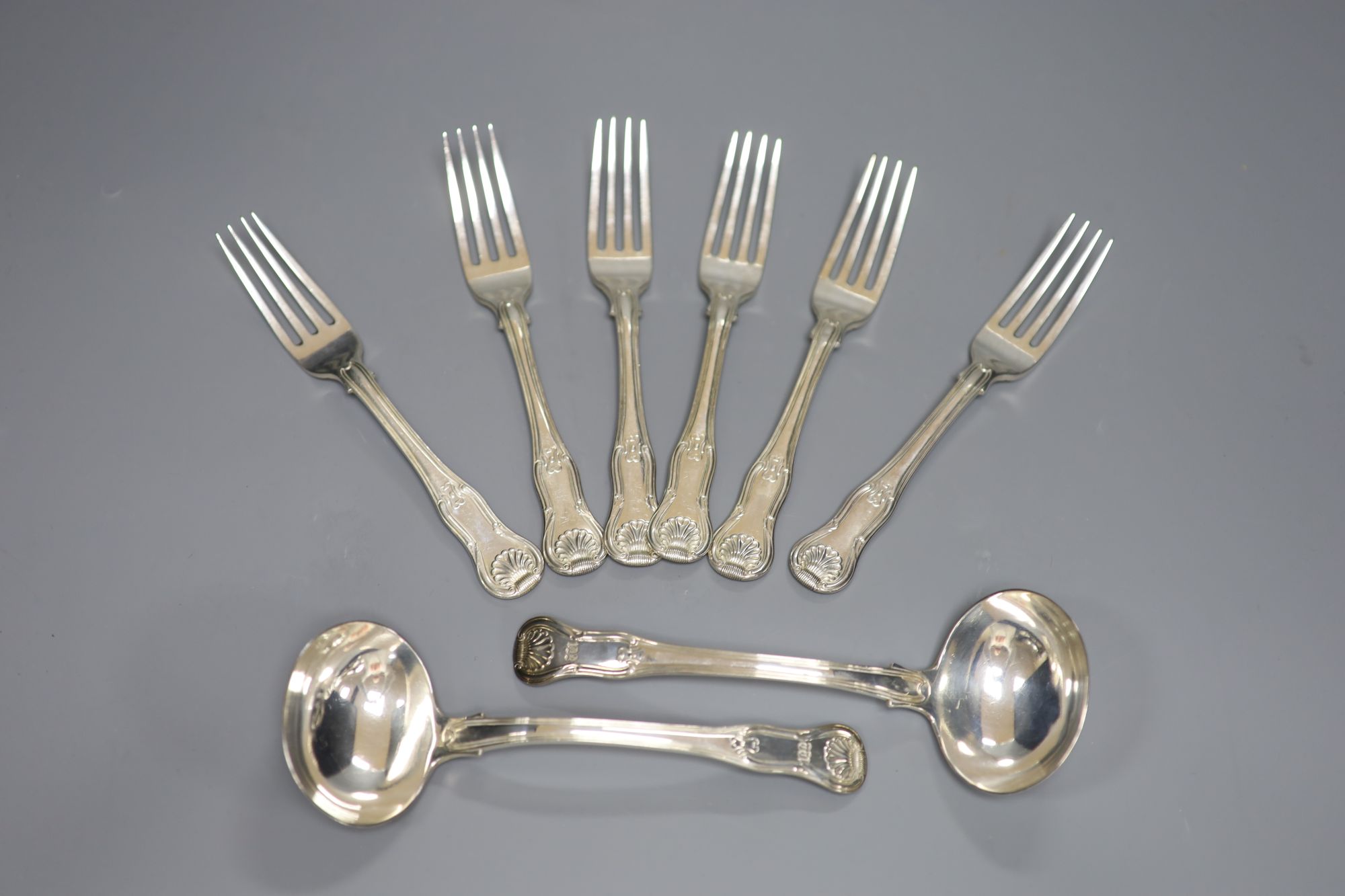 A set of six George III hourglass pattern dessert forks and a pair of sauce ladles, Thomas Wilkes Barker, London, 1818/9 16.8oz.